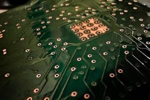 pexels-photo-10084204 A close-up photo highlighting the intricate design of a circuit board PCB with visible connections and solder joints.